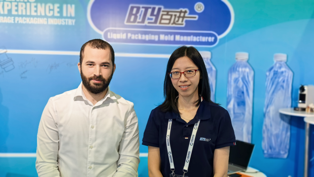 Foshan Baijinyi team interacting with visitors at Gulfood Manufacturing 2025 booth in Dubai
