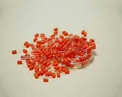 What are the advantages of capsules as drug carriers?