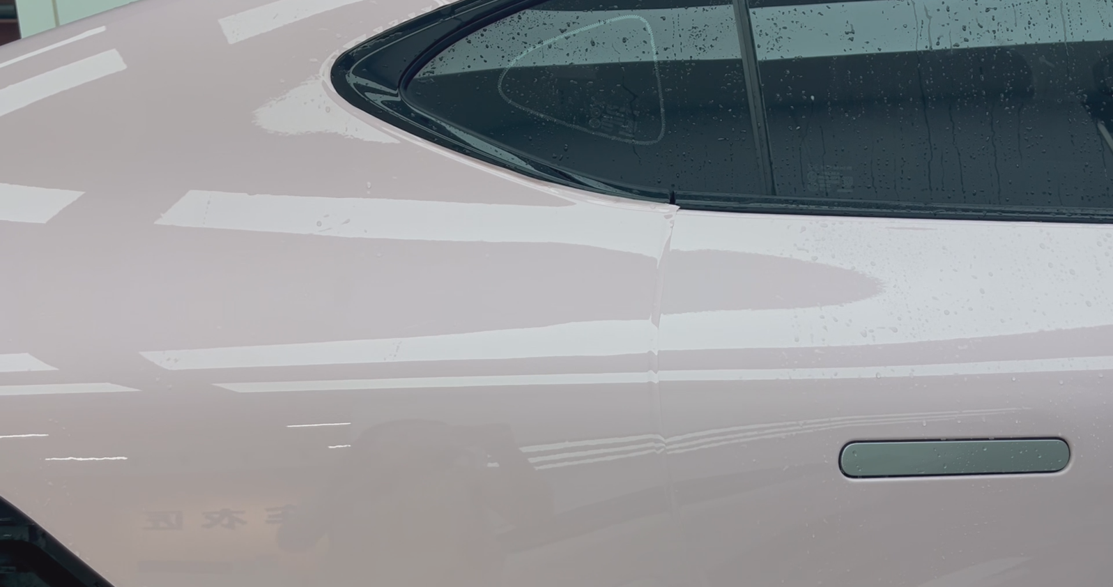 technician installing full body paint protection film on a luxury vehicle