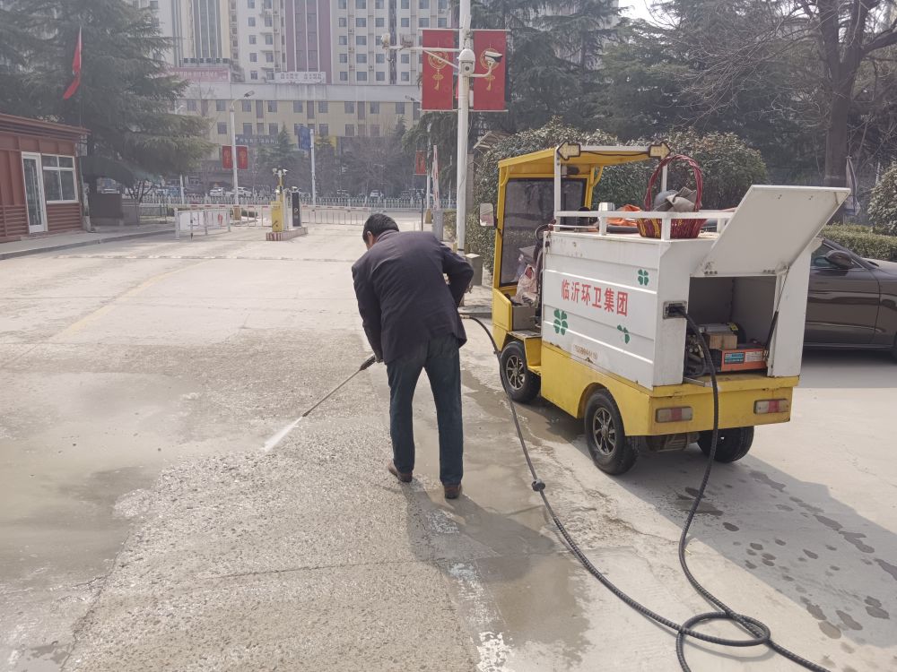 High-pressure water jet washing the groundhgs