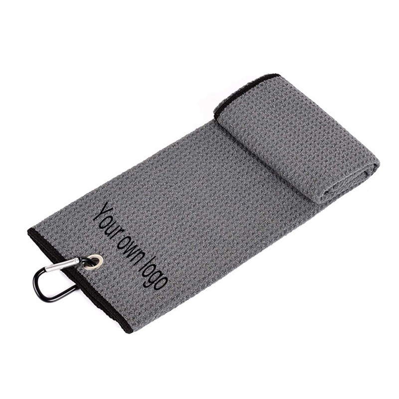 What is the purpose of a golf towel?