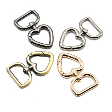 Móc khóa xoay hình trái tim bằng kim loại màu bạc...