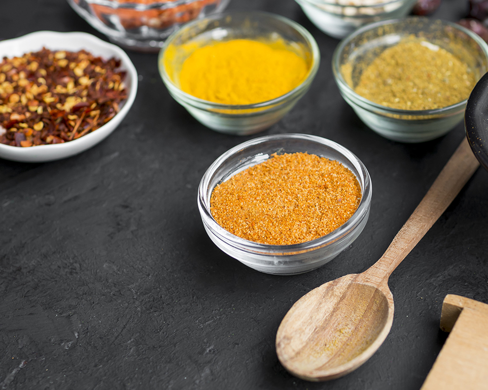 group-bowls-full-spices-black-background