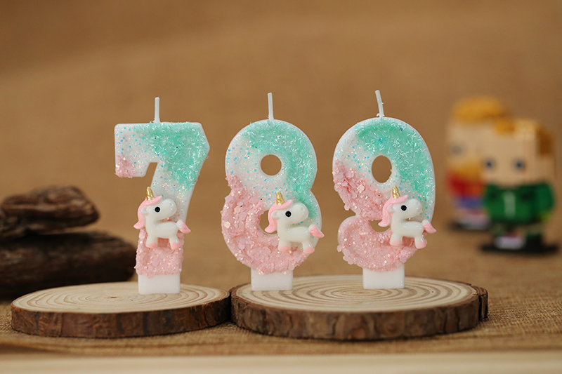 Cute running unicorn decorations adorn digital birthday candle