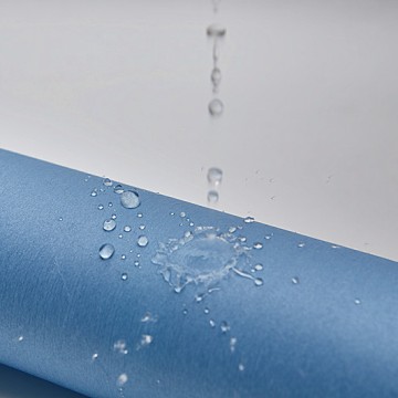 Water-repellent spunlaced nonwoven fabric composed of wood pulp designed for surgical isolation gowns