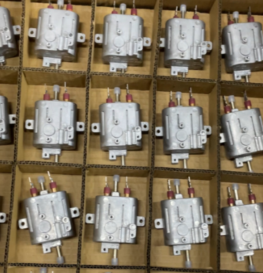 Composants moulés sous pression pour machines à café