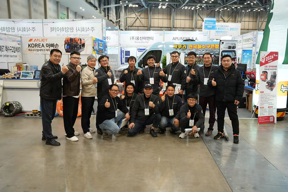 amjet exhibition team group photo with international plumbing professionals.jpg