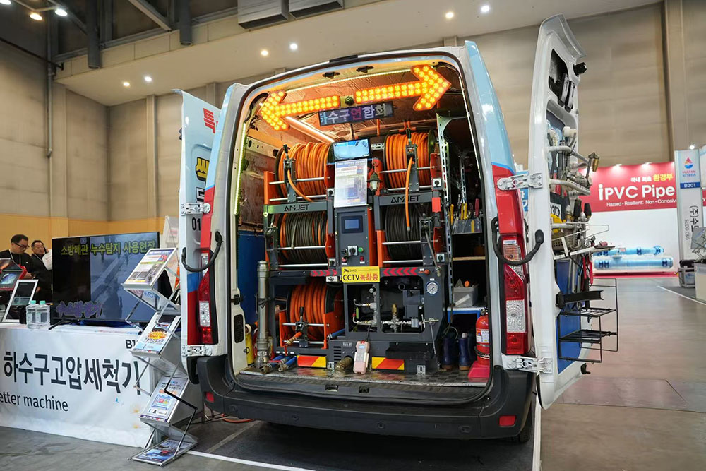 amjet titan series sewer jetter equipment demonstration at trade show.jpg