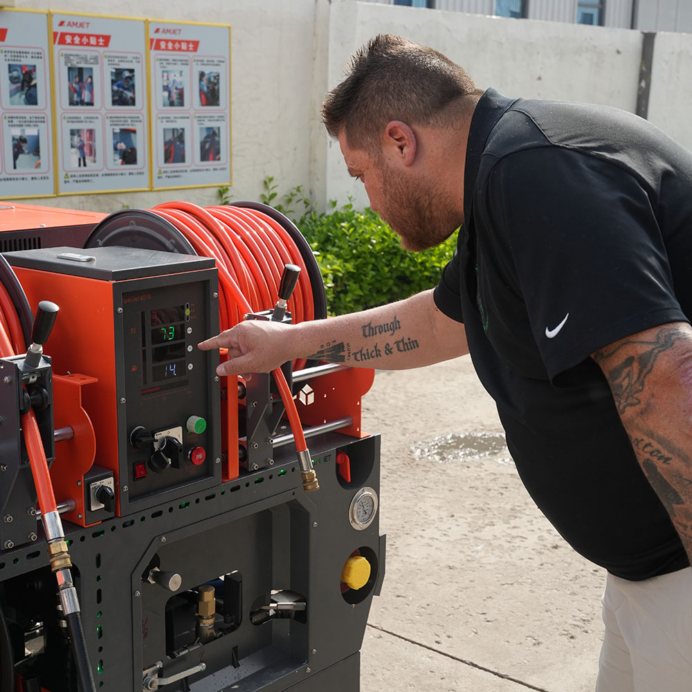Close-up of Titan 190HP sewer cleaning machine control system testing.jpg