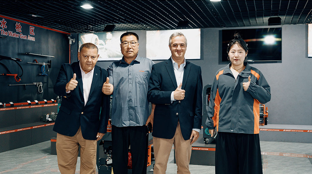 Customer visiting sewer jetter production line in Amjet factory.jpg