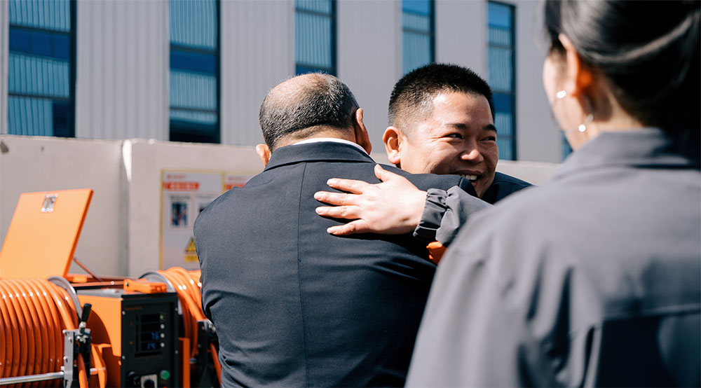 Overseas customer team at Amjet sewer cleaning machine factory.jpg