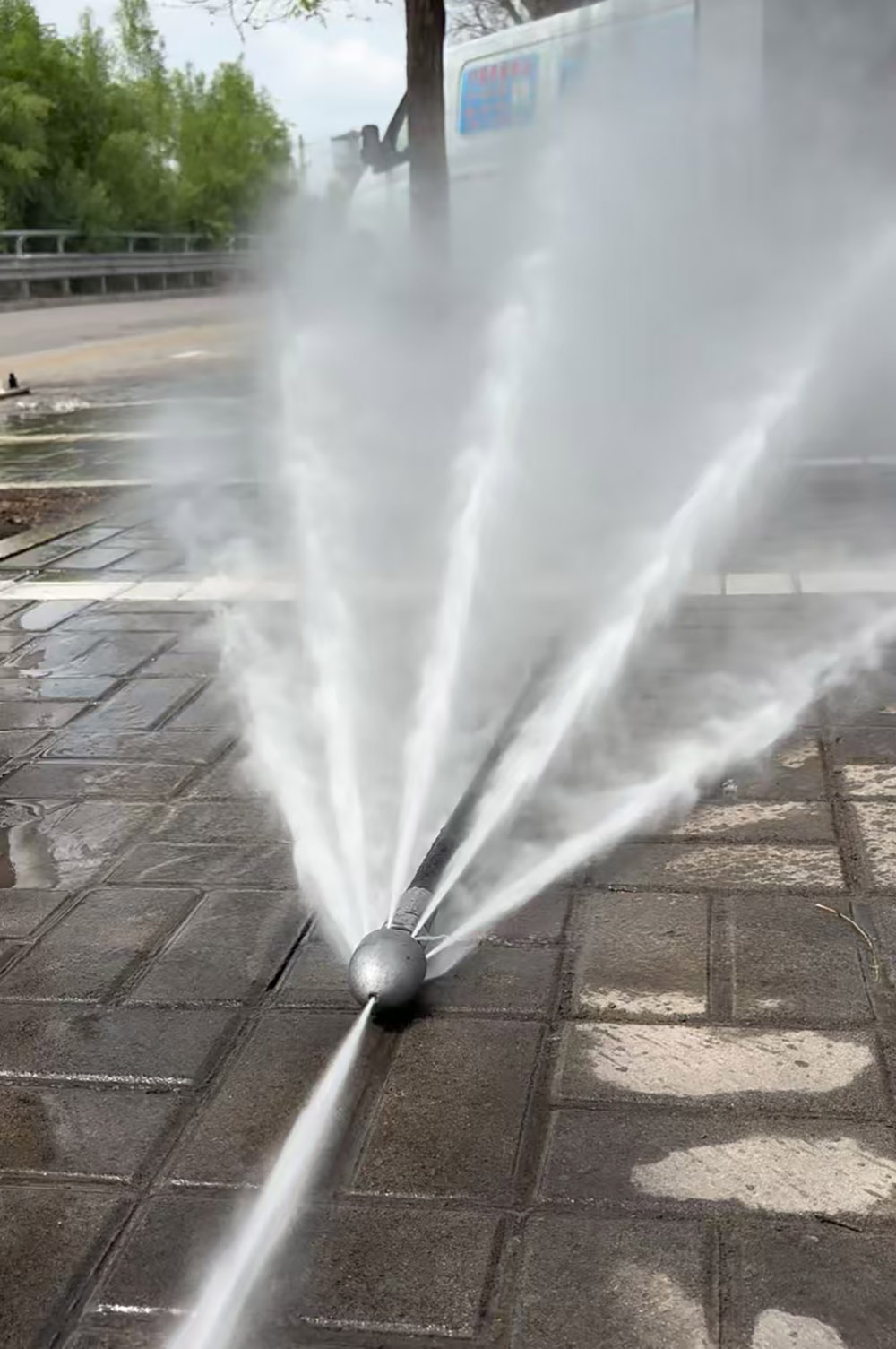 sewer jetter nozzle working with full pressure water spray.jpg