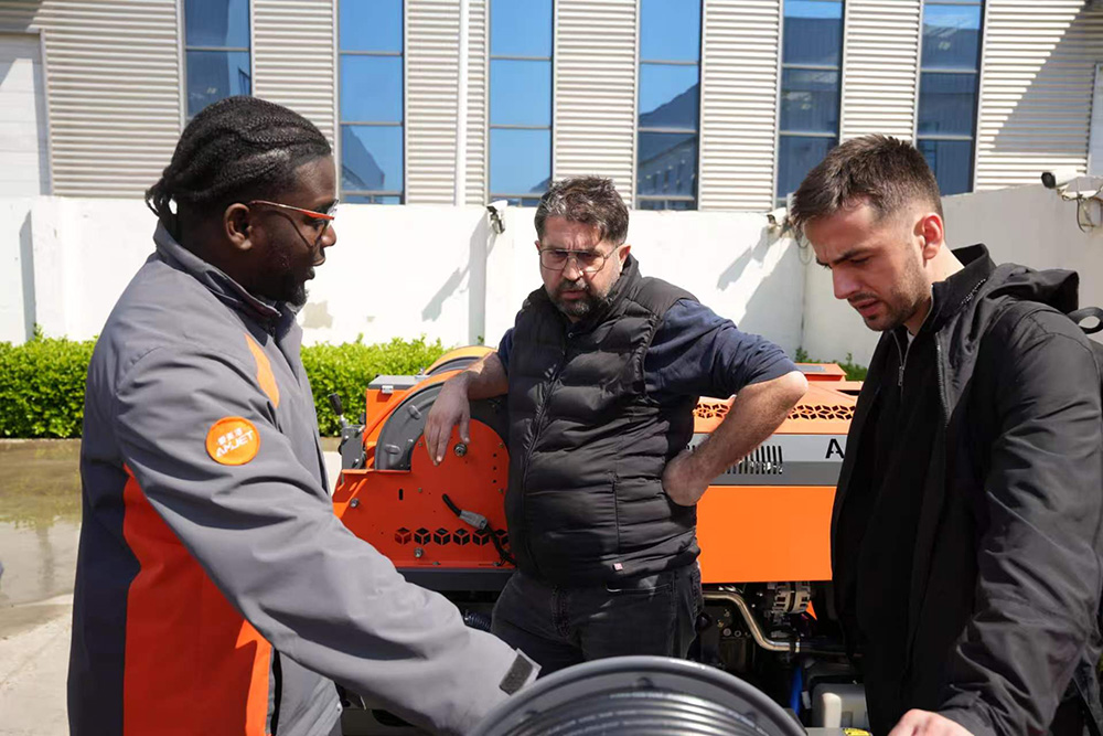 Turkish municipal cleaning company visiting Amjet for custom pressure washer solution discussion.jpg