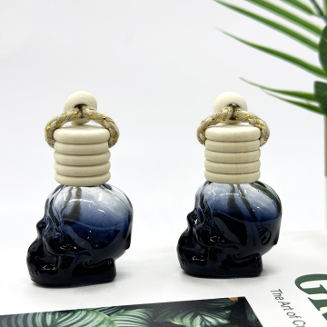 Frasco de perfume para coche con forma de calavera negra mate. Aceite de perfume...