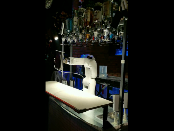 Robotic arm mixes cocktails