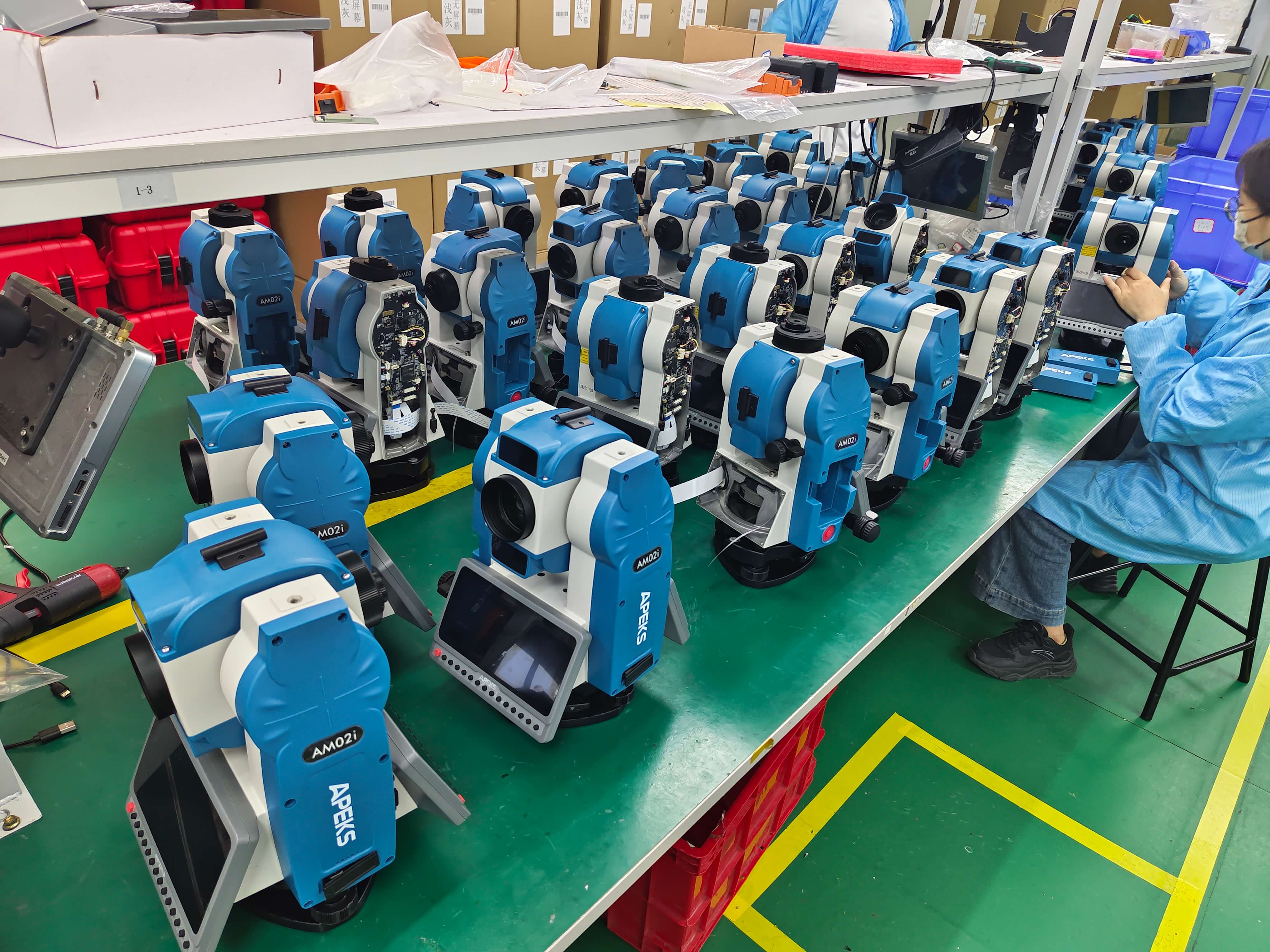 APEKS AM02i Android total station units aligned on the factory assembly line