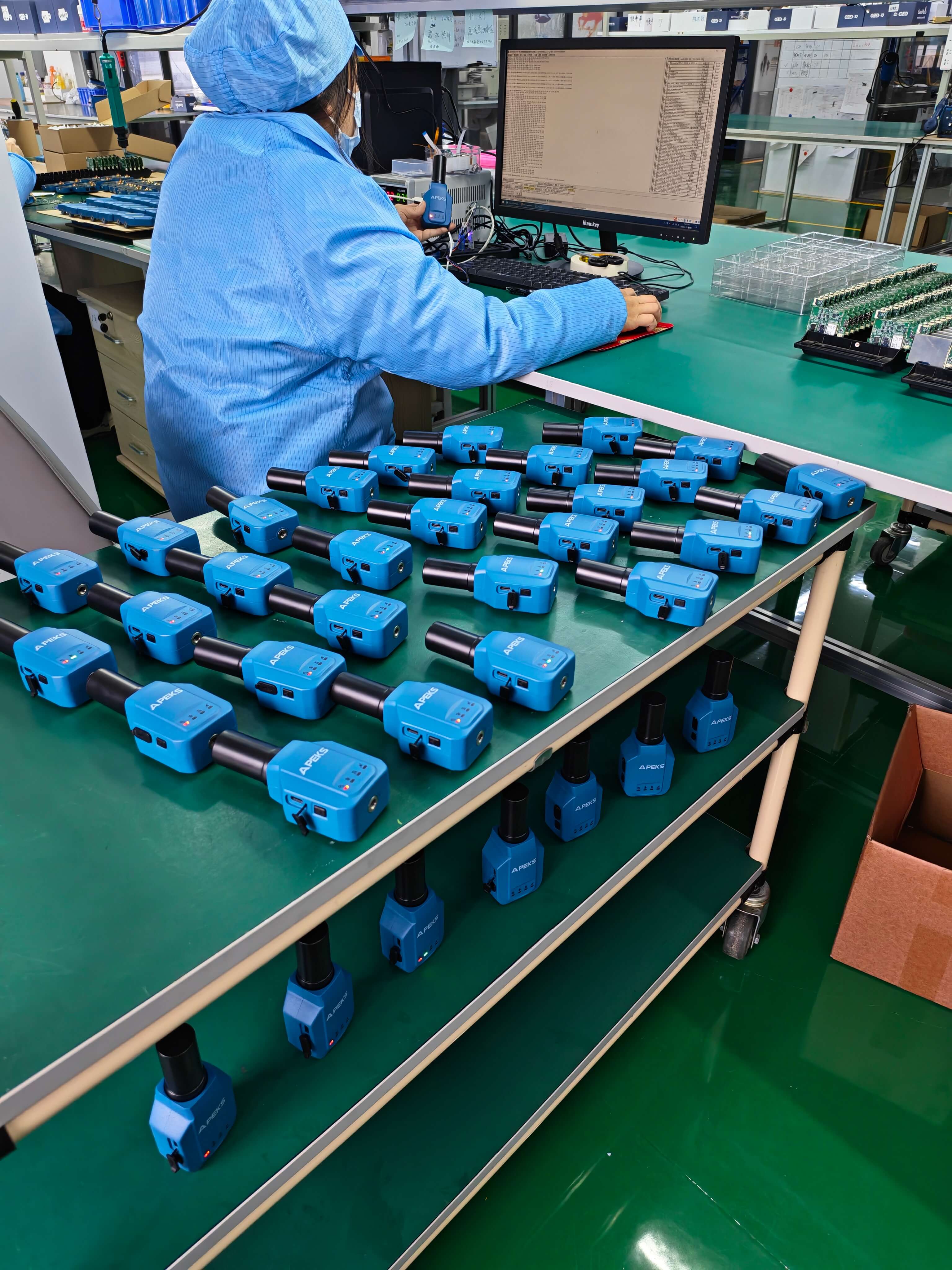 Batch power and operational aging test of APEKS APS1 handheld RTK units on the factory rack