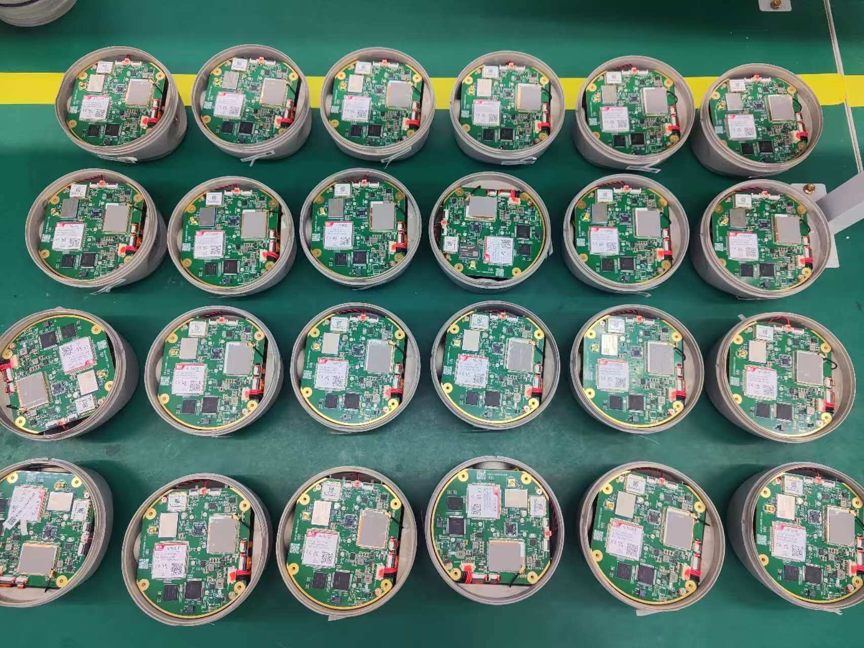 Top-down view of internal GNSS processing boards and RF components installed into receiver bottom housings
