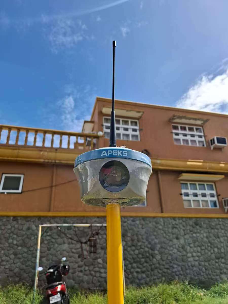 APEKS MAX5 GNSS base station with long-range radio whip antenna deployed for drone survey operations