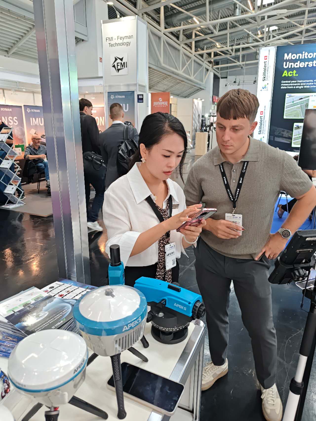 APEKS AScan X1 SLAM LiDAR component showcased to a visitor at INTERGEO 2026