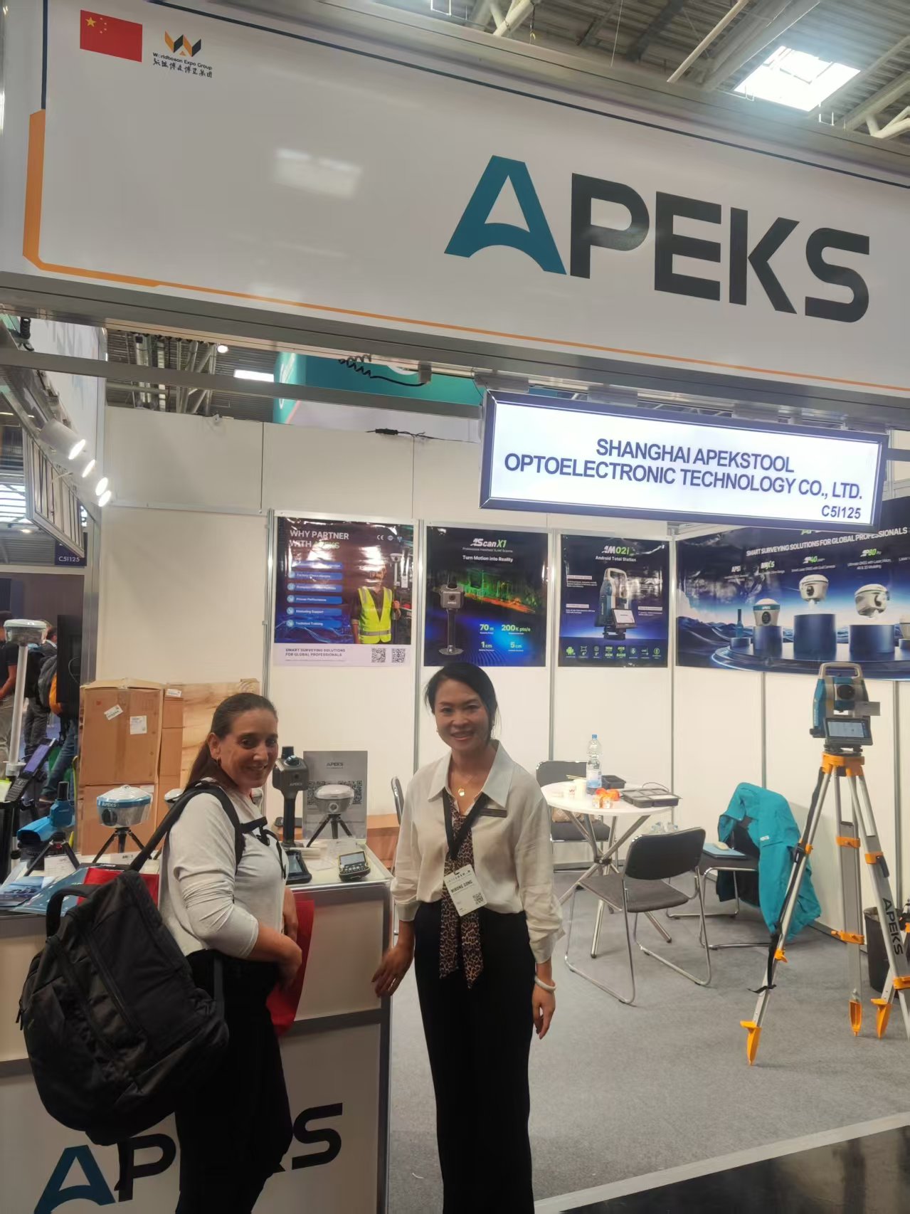 APEKS representative posing with an international visitor at INTERGEO 2026