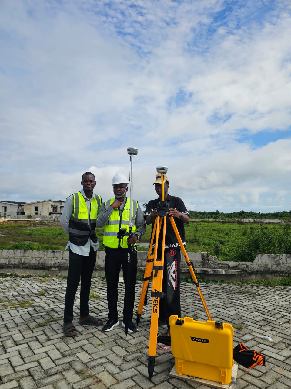 Local survey team deploying APEKS RTK GNSS base and rover system for land boundary mapping in Nigeria