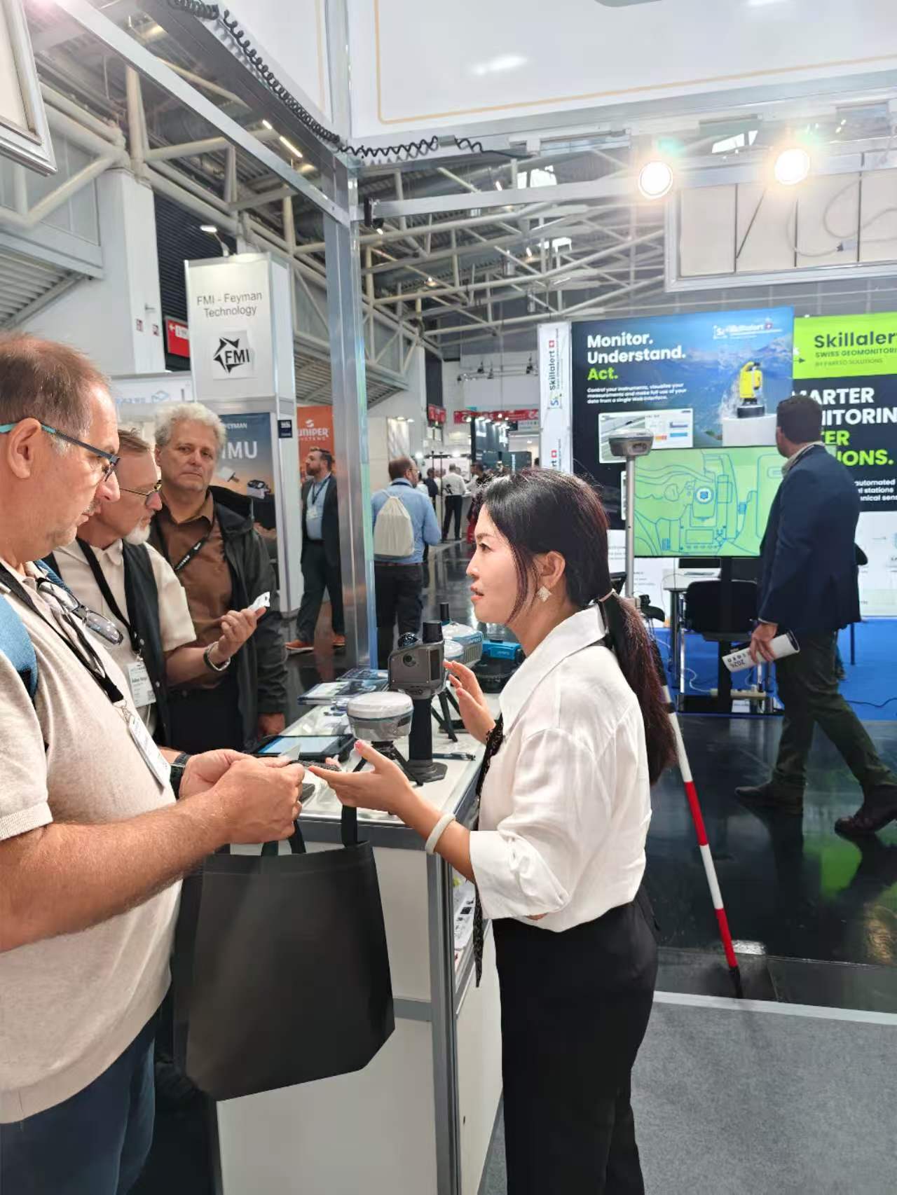 APEKS staff in conversation with a group of visitors at INTERGEO 2026