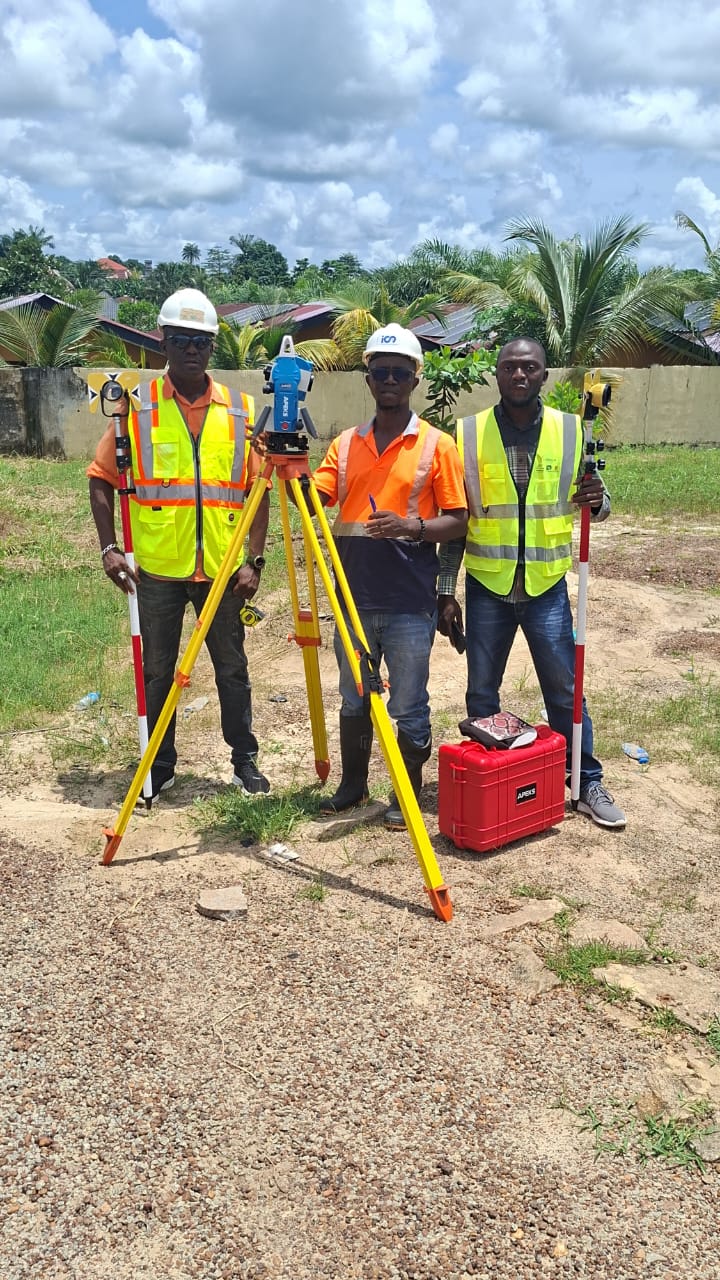 Survey team measuring a boundary point using prism method
