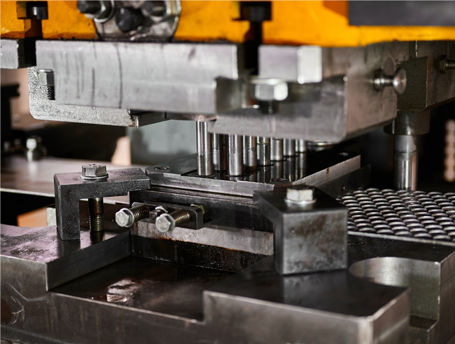 What is the difference between stamping and punching?