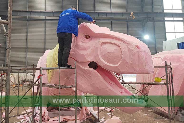 Foam shaping on a large dinosaur for the Lugo project