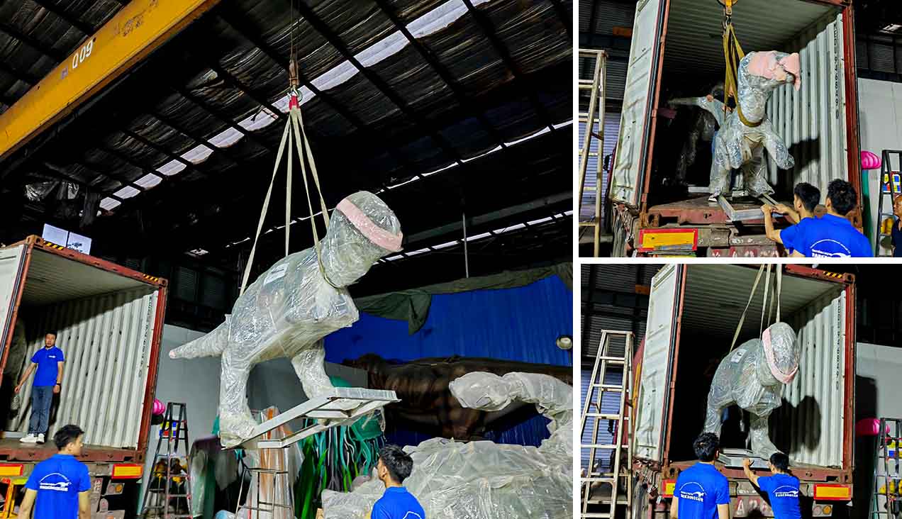 Parkdinosaur workers loading a protected dinosaur into a shipping container
