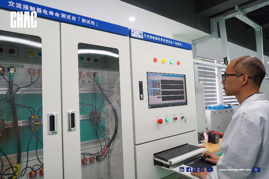 Technician monitoring the AC Contactor Electrical Life Test Cabinet for arc erosion patterns at the CHAC Testing Center.