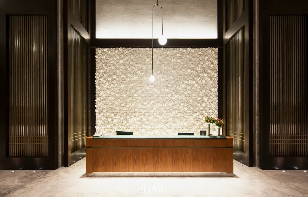 The White Hibiscus Wall: How Custom Ceramic Art Became a Luxury Hotel's Defining Feature