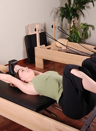 Pilates vs. Yoga: Which Practice Unlocks Your Fitness Goals? Find Your Perfect Match with Lumine Equipment