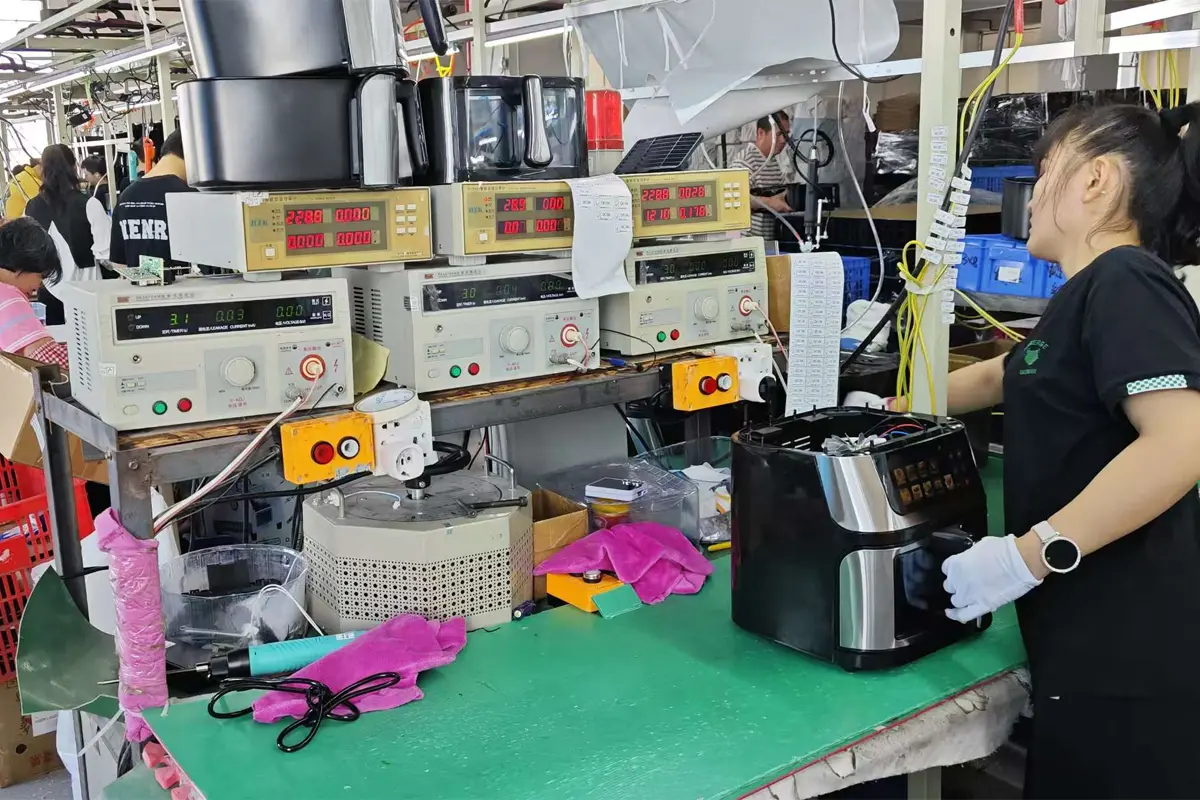 Air fryer functional check station in APEXDURA production assembly workshop