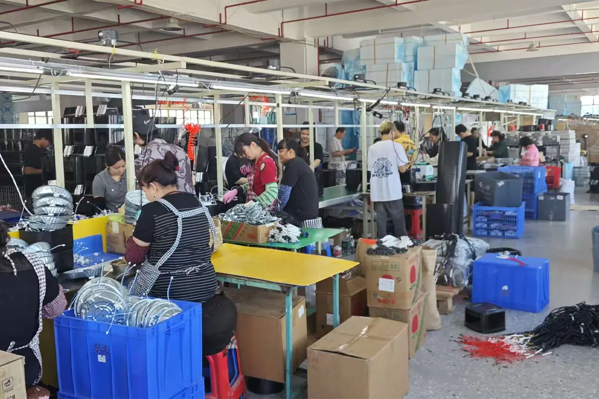 APEXDURA production assembly workshop with workers assembling kitchen appliances on the line