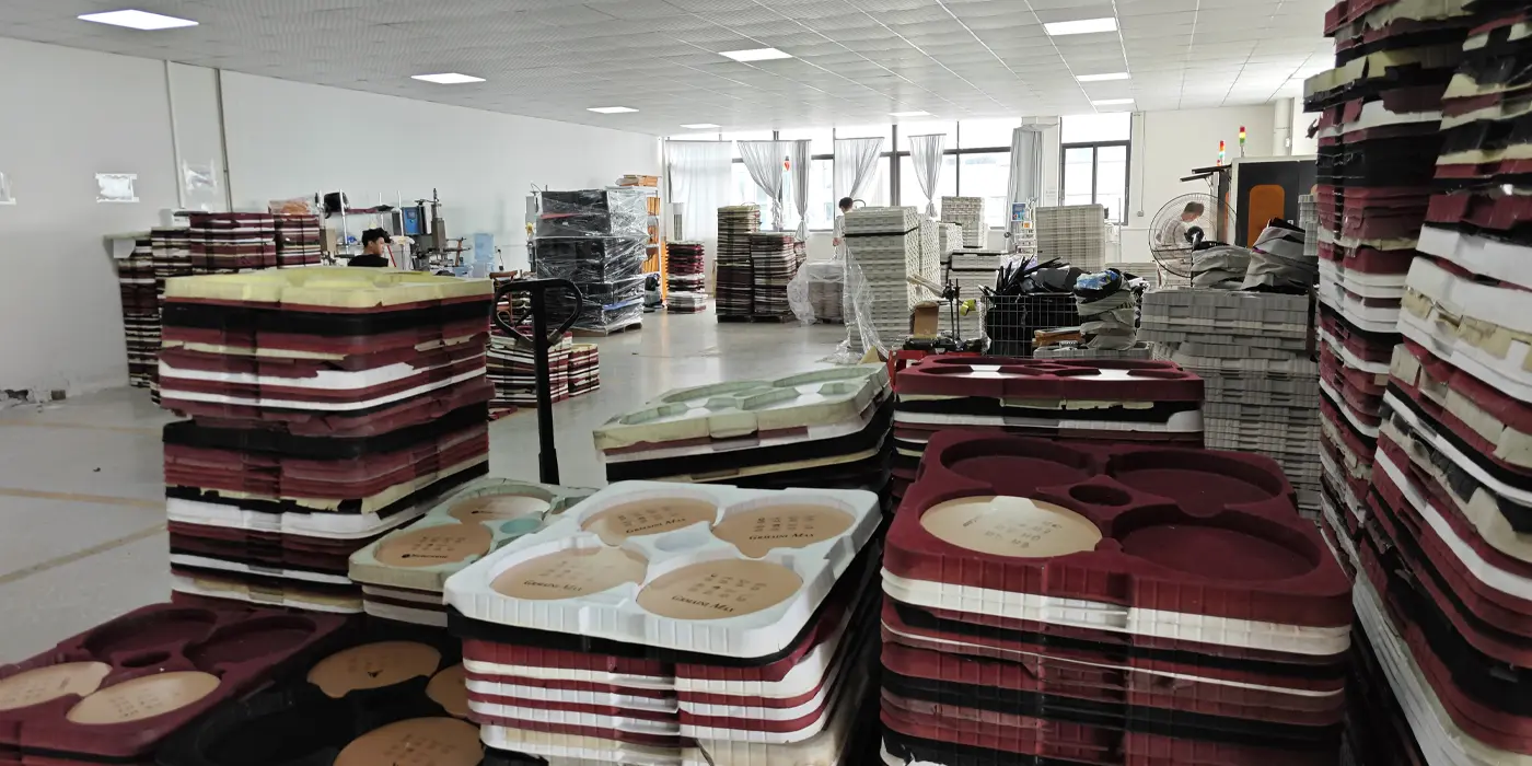 Wide view of APEXDURA silk screen printing workshop with appliance parts and trays