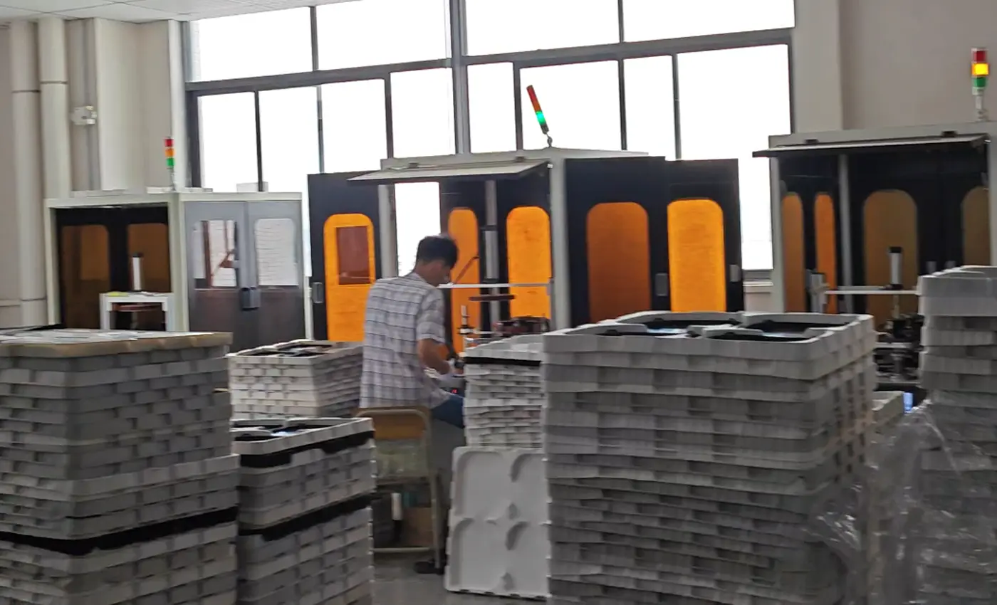 APEXDURA printing workshop with equipment and stacked appliance parts