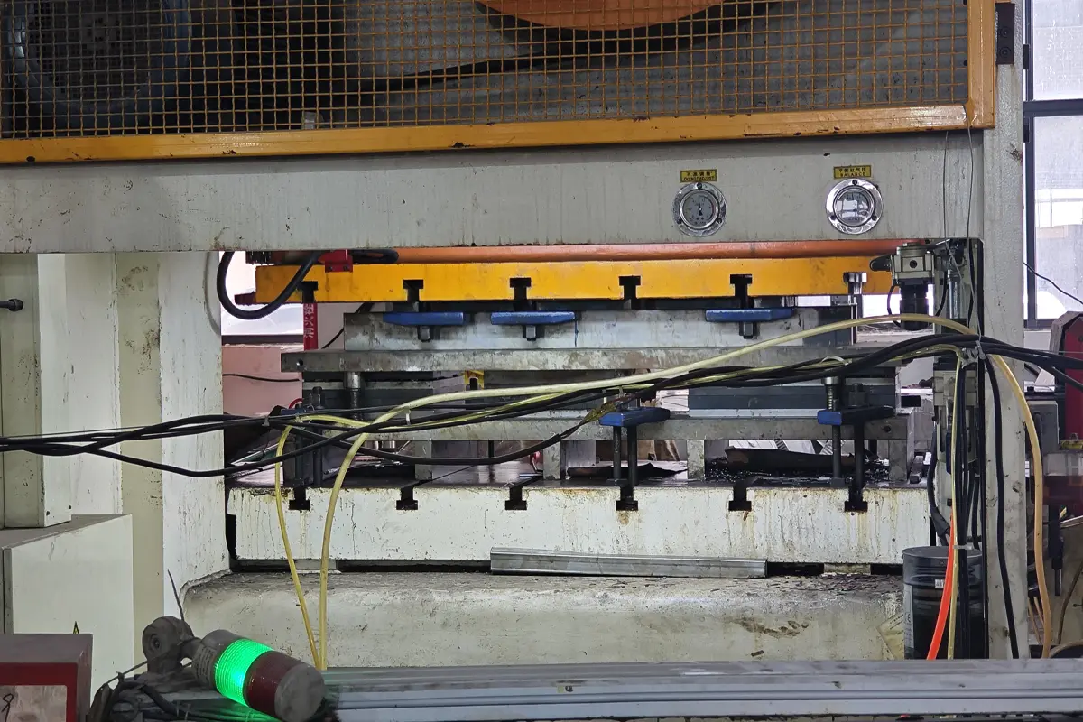Close view of stamping die area for forming metal appliance parts