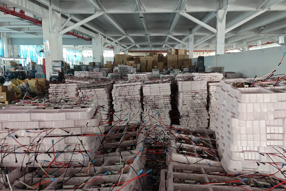 Work-in-progress trays of appliance circuit boards with wires in APEXDURA PCB workshop