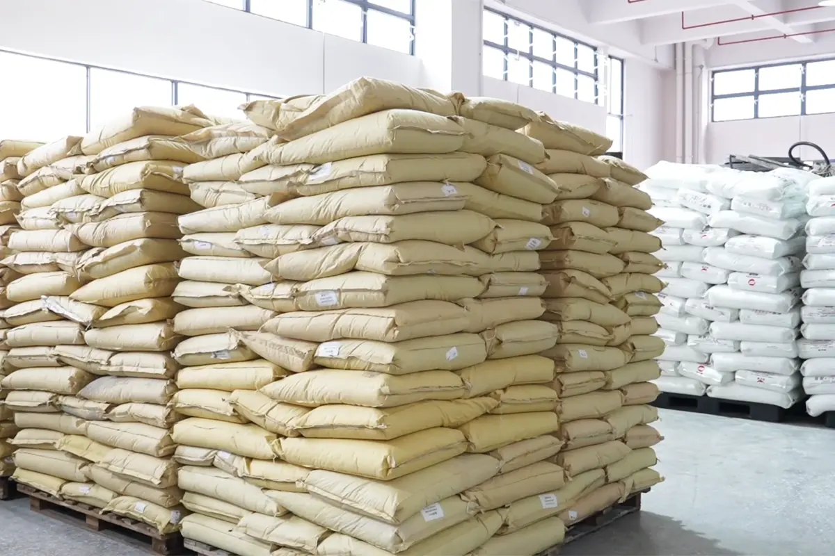 Plastic resin bags stored in the injection molding workshop before production