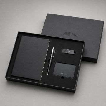Kit de brindes corporativos personalizado com caderno, caneta, pen drive e porta-cartões.
