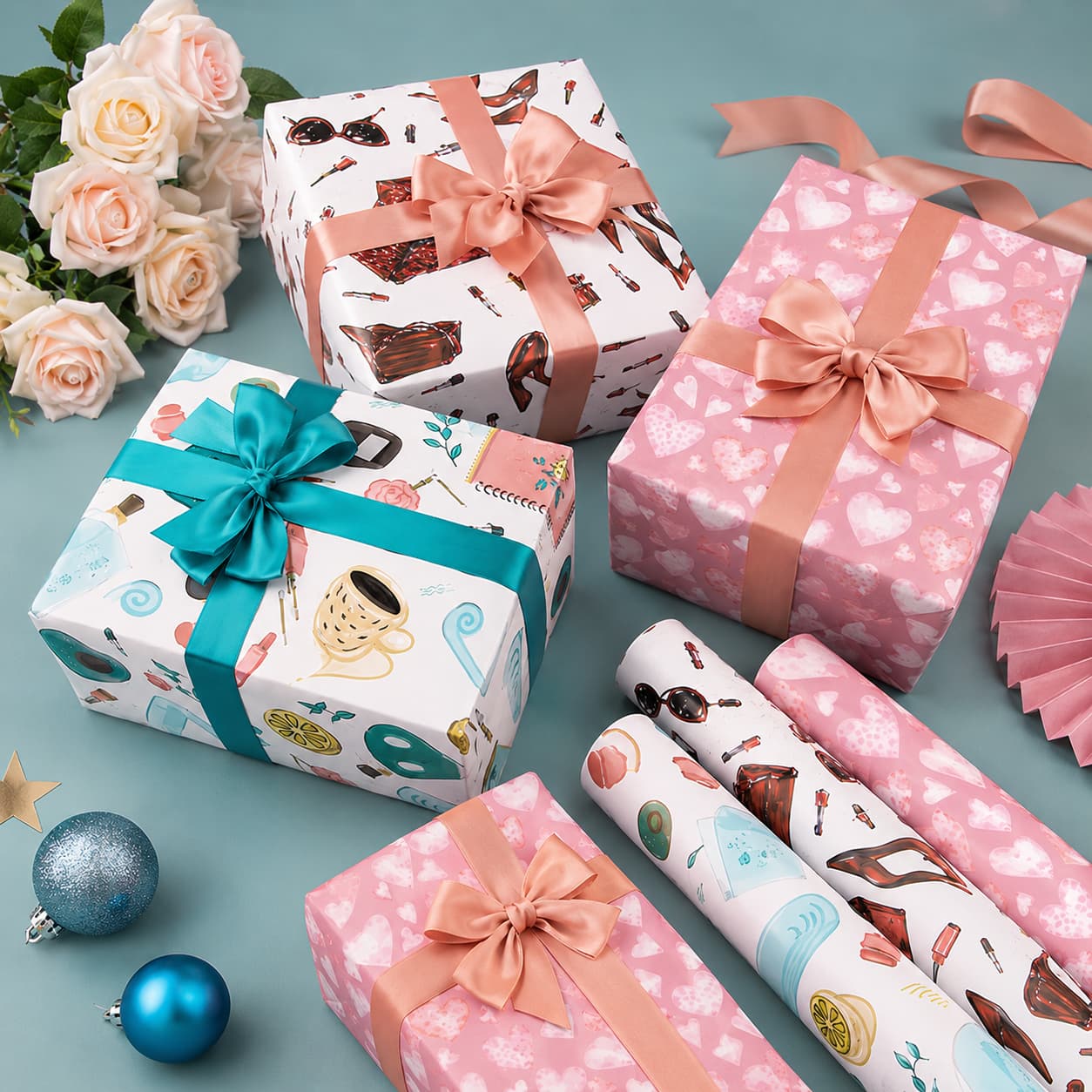 Wrapped boxes and printed paper rolls in three coordinated styles.