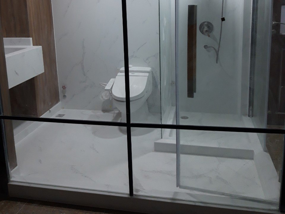 Solid Surface Creates Seamless, Integrated Shower Space for Lasting Waterproofing and Hygiene