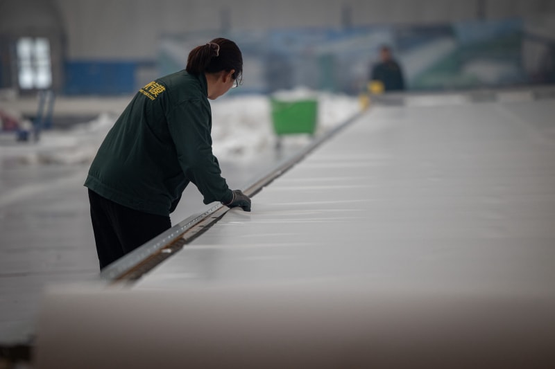 Lay the membrane material on the automated cutting machine