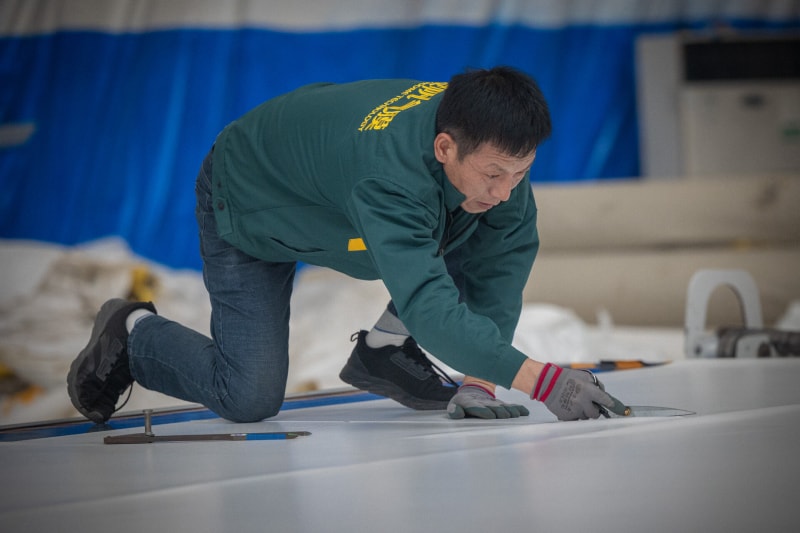 Manually trim the edges of the membrane material