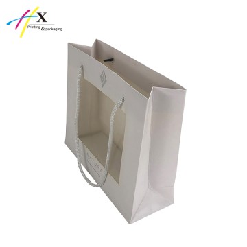 Small white paper bag with clear window 