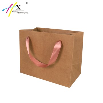 Brown kraft paper shopping bag with rose gold logo   