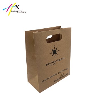 Kraft paper bag with die cutting handle