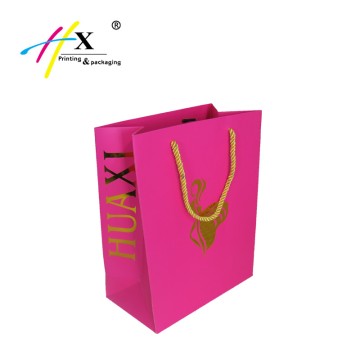 Pink paper shopping bag with gold stamping logo 